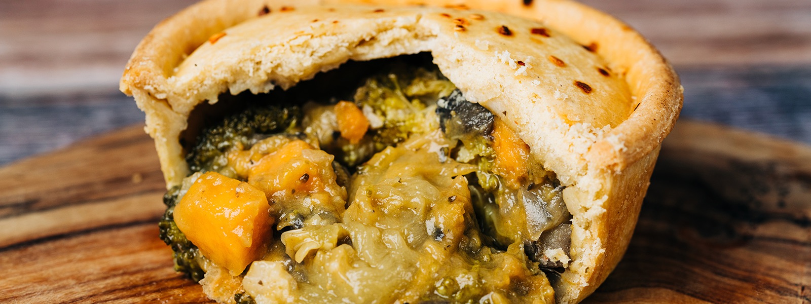 A gluten-free vegetable pie cut open to show the filling